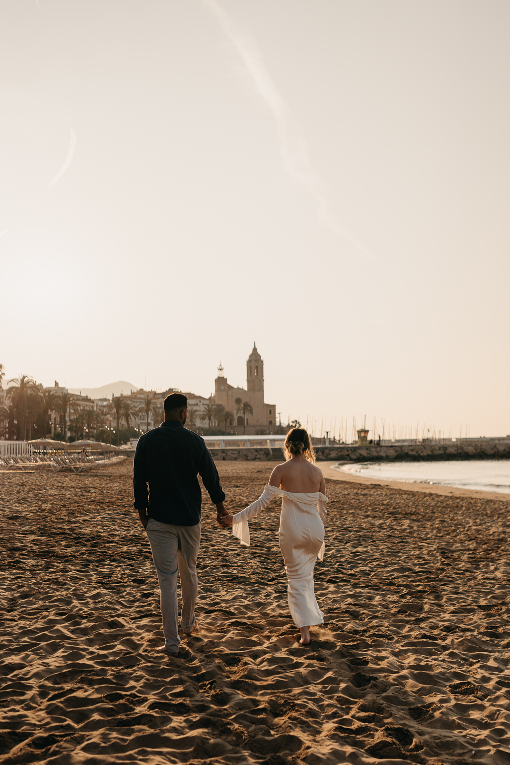 Sunrise golden hour photographs at Sitges beach, before Barcelona wedding at Almiral de la Font