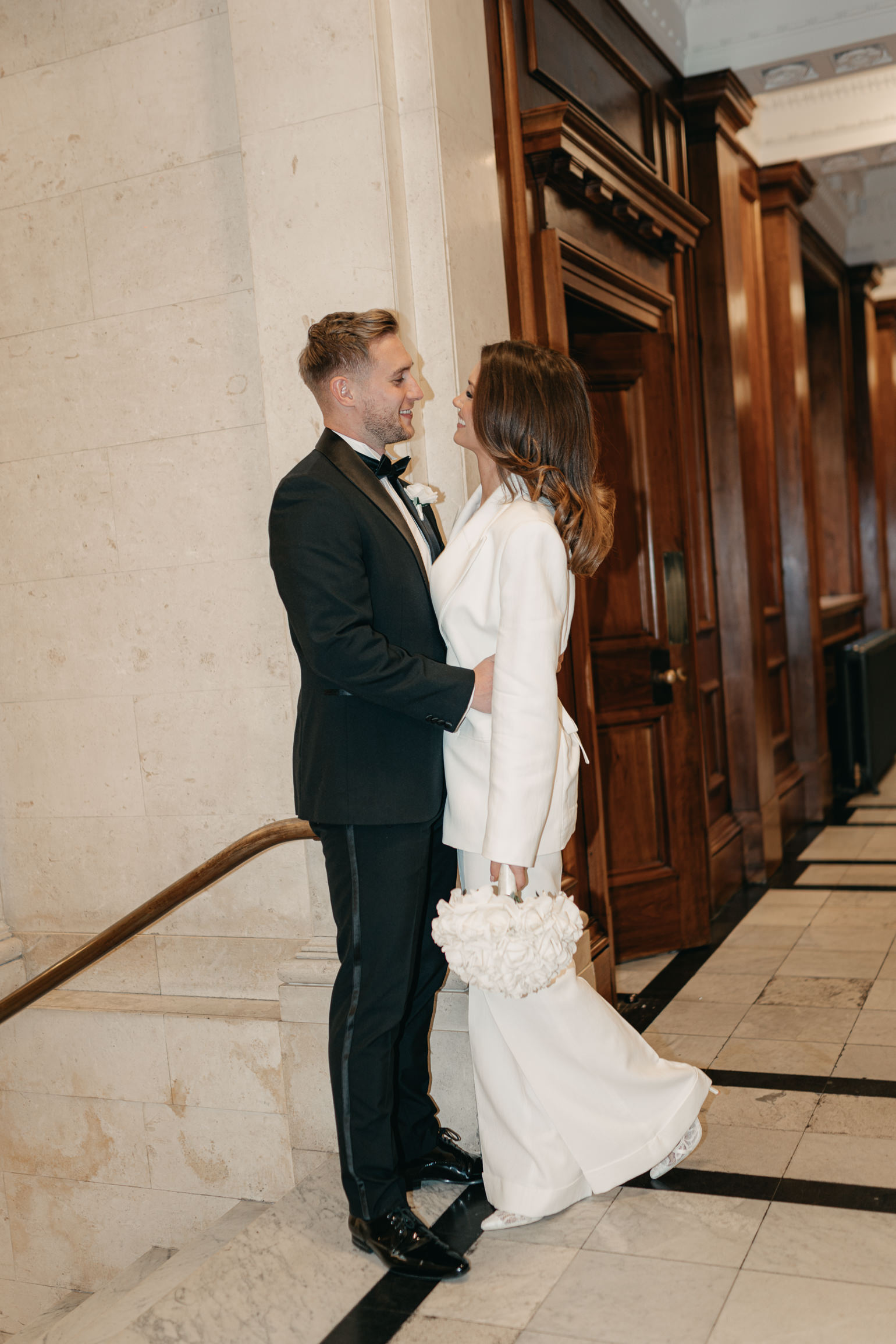 london editoral wedding photography, with Victoria Beckham bridal suit. london wedding photographer, black-tie London Wedding. Flash wedding photography.