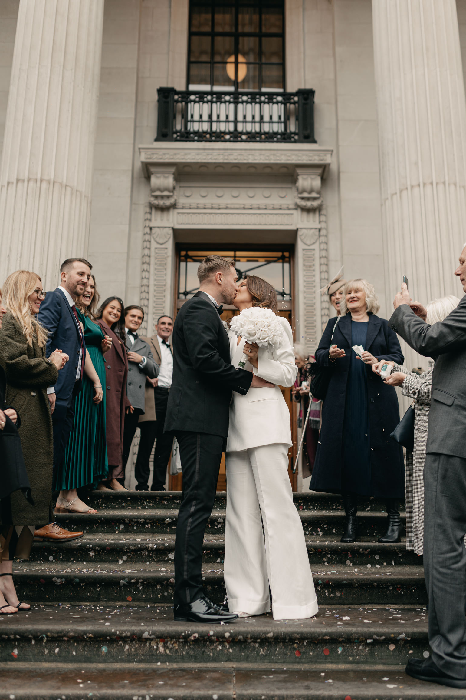 London wedding confetti with Victoria Beckham bridal suit. london wedding photographer, black-tie editorial London Wedding 