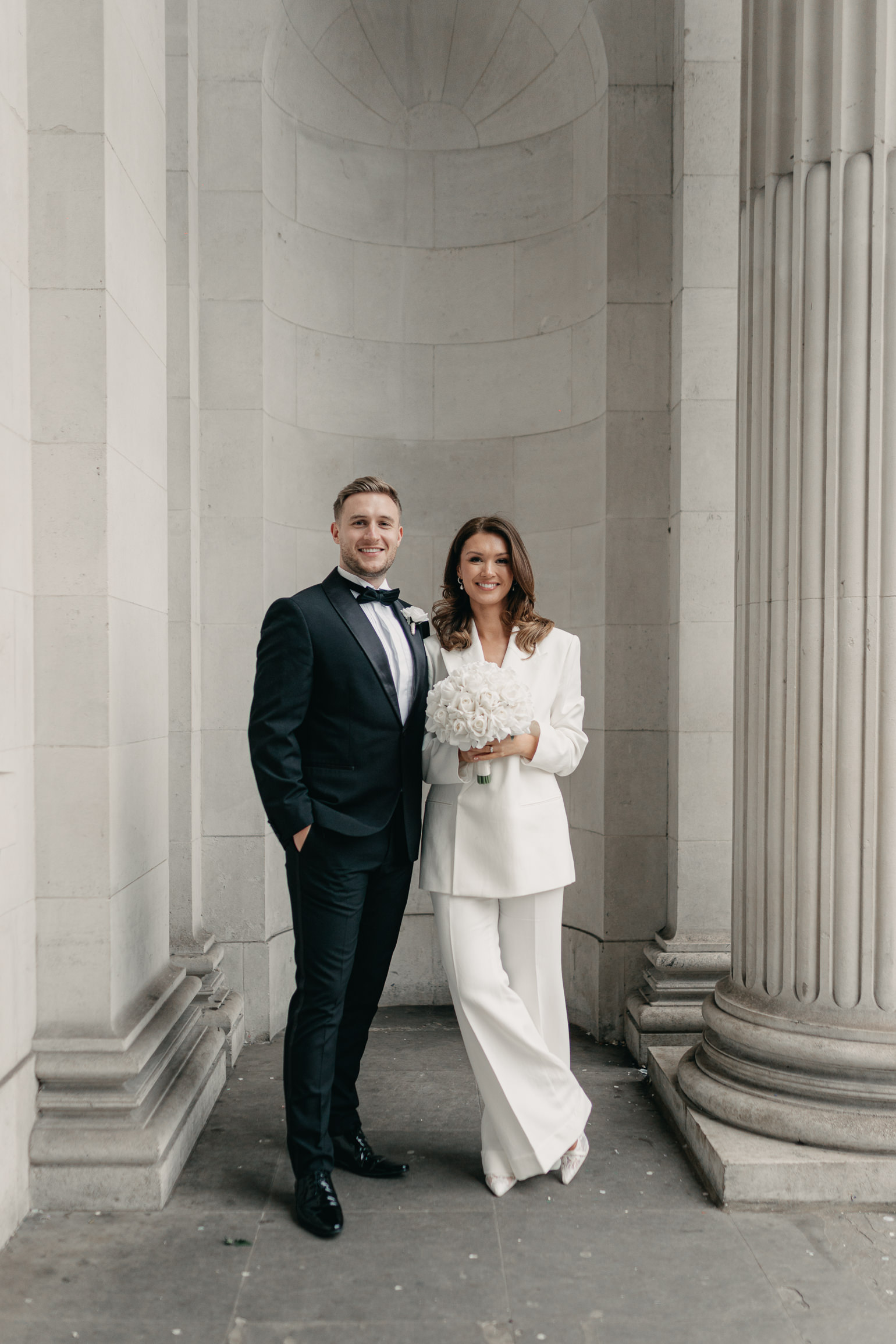 Marylebone Town hall wedding ceremony, with Victoria Beckham bridal suit. london wedding photographer, black-tie editorial London Wedding 